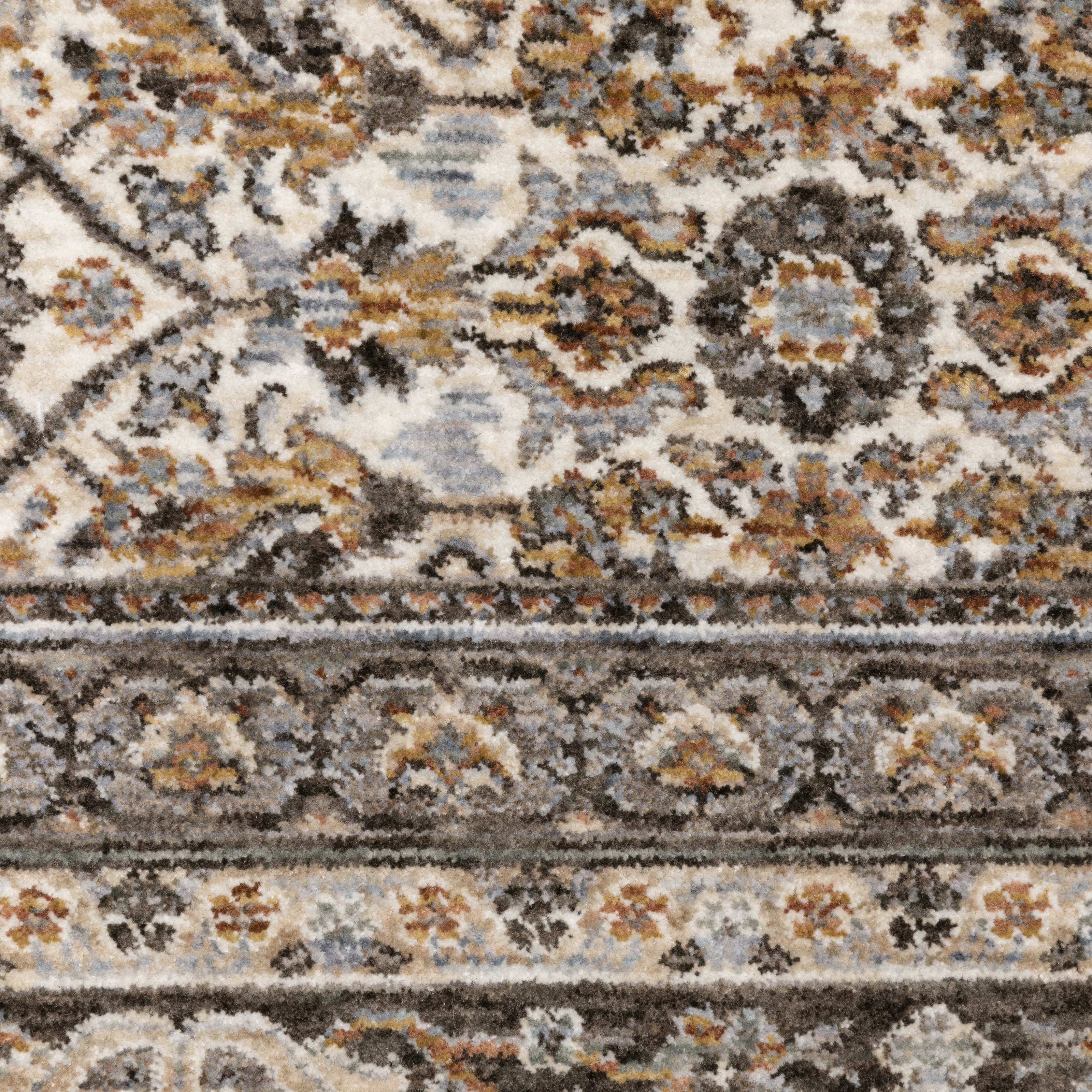 Traditional ornate rug with cream and brown geometric floral border pattern