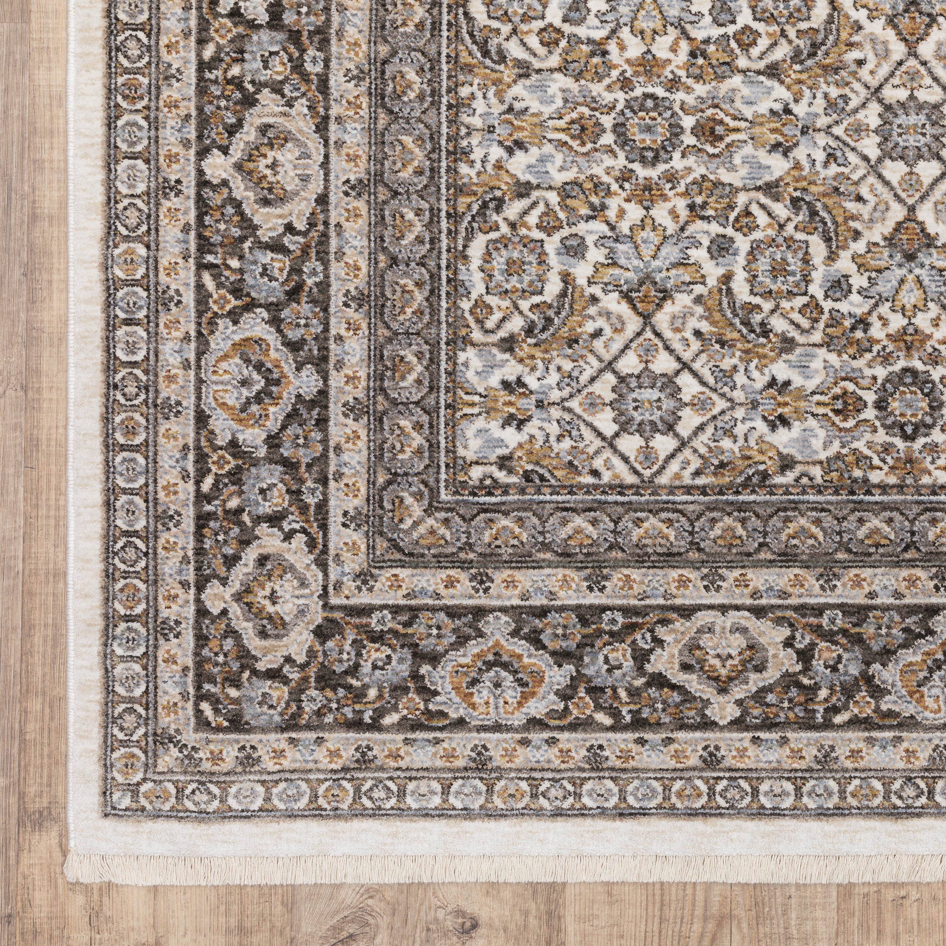 Traditional ornate rug with cream and brown geometric floral border pattern