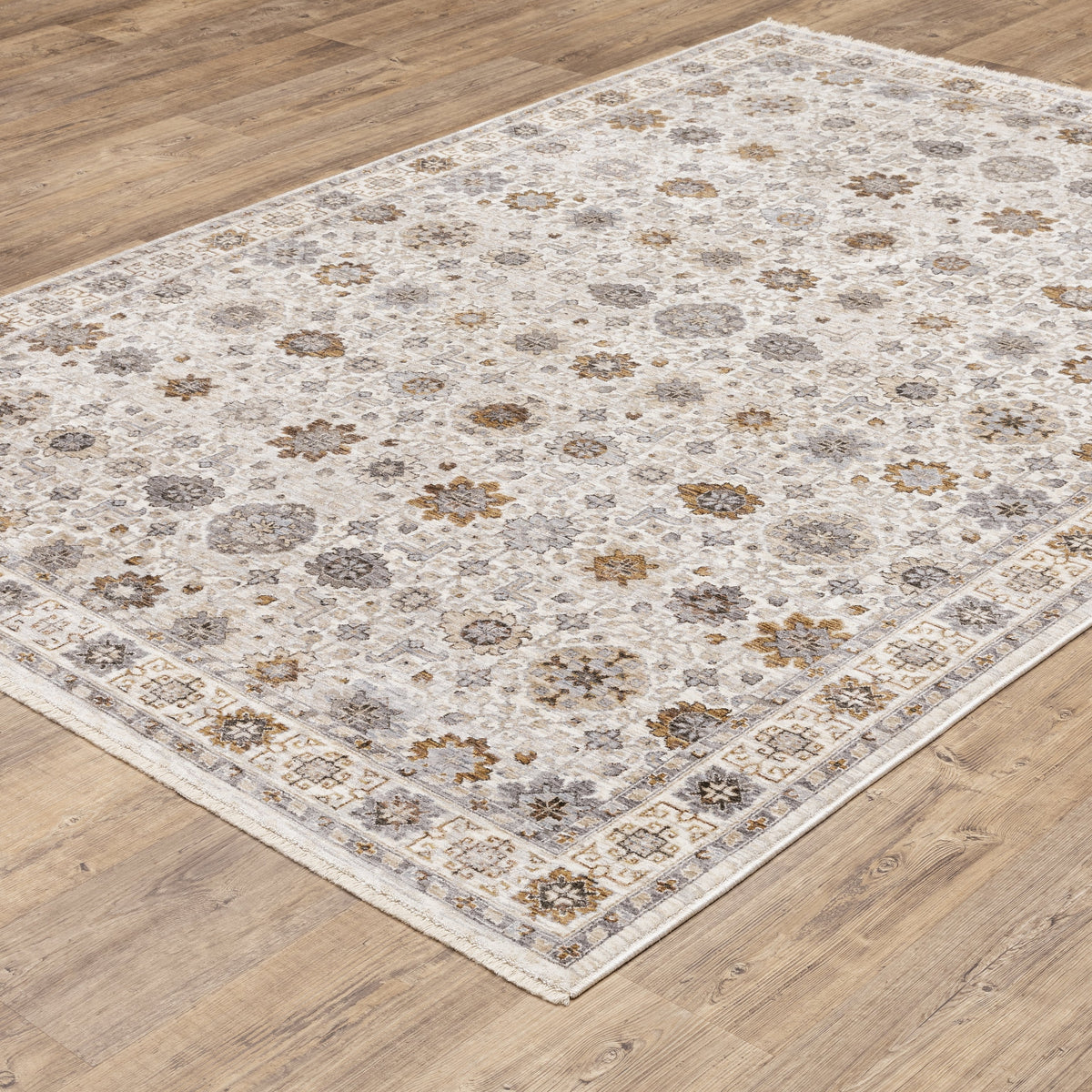 Beige traditional rug with brown and grey floral medallion pattern and ornate border