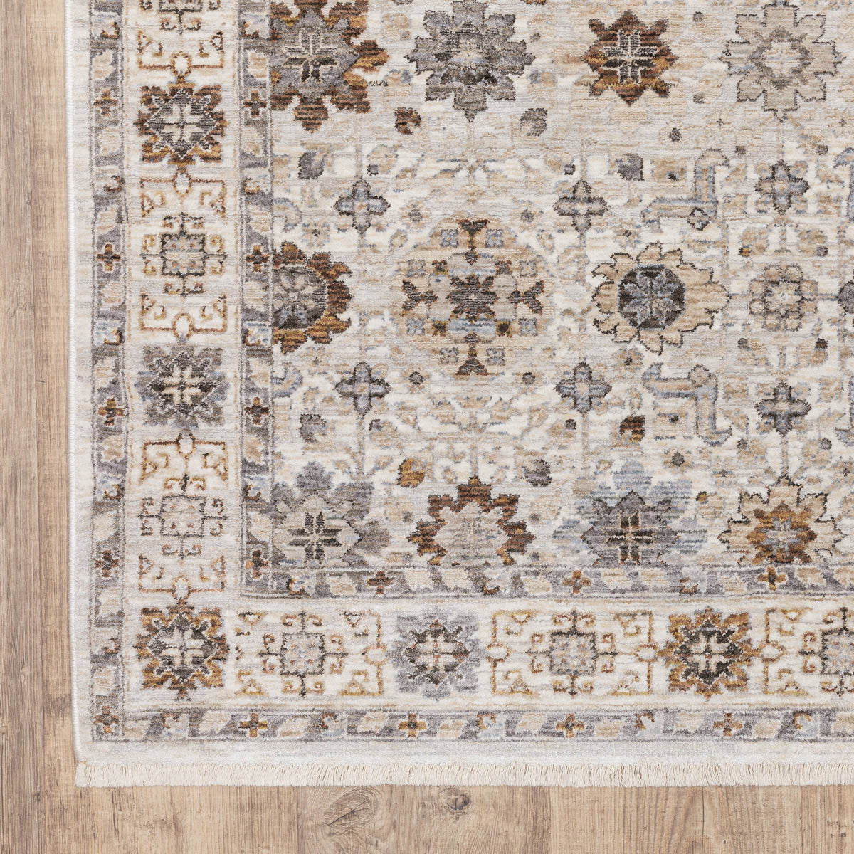 Beige traditional rug with brown and grey floral medallion pattern and ornate border