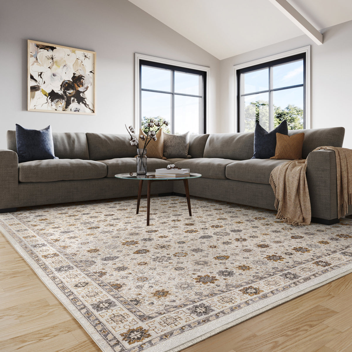 Beige traditional rug with brown and grey floral medallion pattern and ornate border