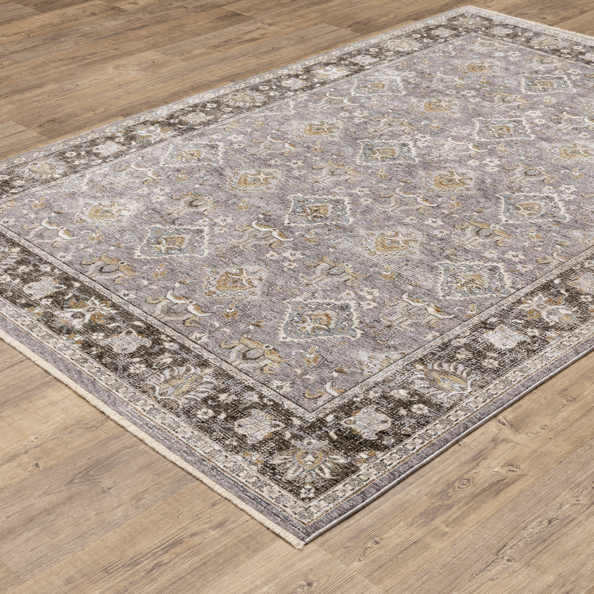 Grey and gold traditional patterned rug with dark ornate border