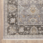 Grey and gold traditional patterned rug with dark ornate border