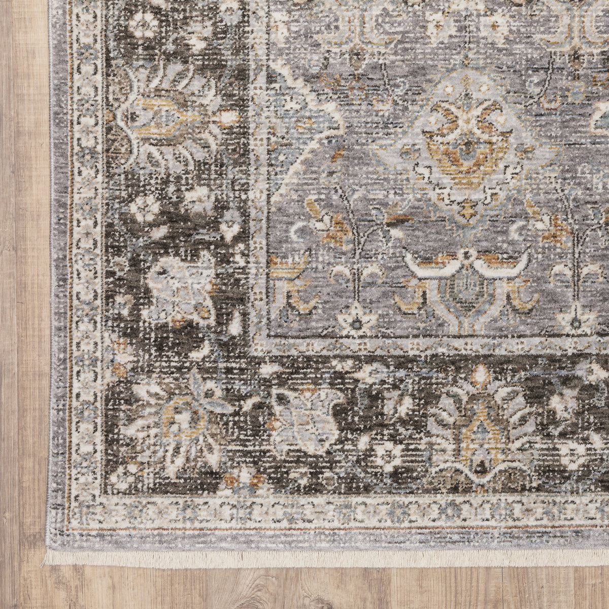 Grey and gold traditional patterned rug with dark ornate border