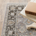 Grey and gold traditional patterned rug with dark ornate border
