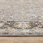 Grey and gold traditional patterned rug with dark ornate border