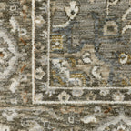 Traditional beige rug with blue and gold geometric medallion pattern and ornate borders