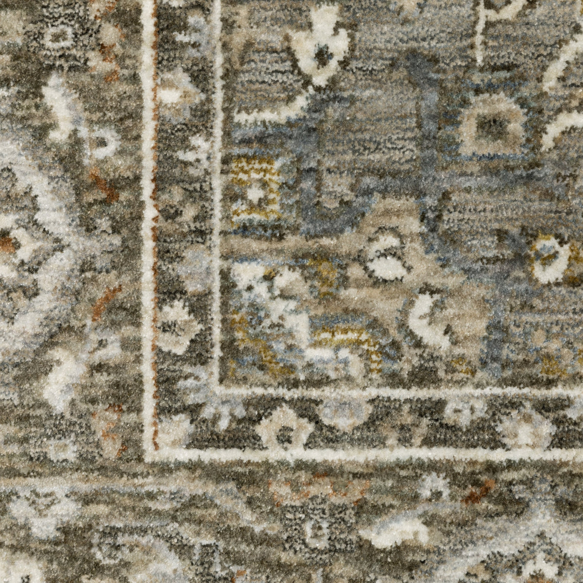 Traditional beige rug with blue and gold geometric medallion pattern and ornate borders