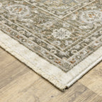 Traditional beige rug with blue and gold geometric medallion pattern and ornate borders