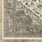 Traditional beige rug with blue and gold geometric medallion pattern and ornate borders
