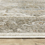 Traditional beige rug with blue and gold geometric medallion pattern and ornate borders