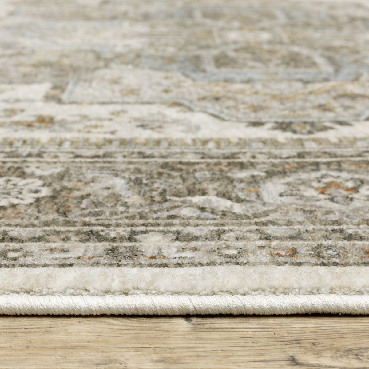 Traditional beige rug with blue and gold geometric medallion pattern and ornate borders
