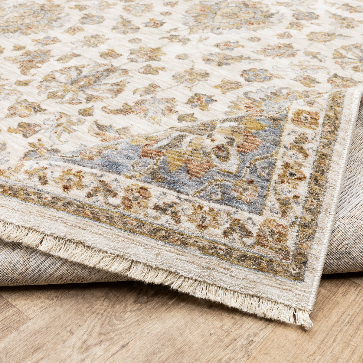 Cream and blue traditional floral area rug with ornate damask border design