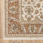 Classic floral pattern rug with cream center, terracotta border and ornate medallion design