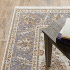 Cream and blue traditional floral area rug with ornate damask border design