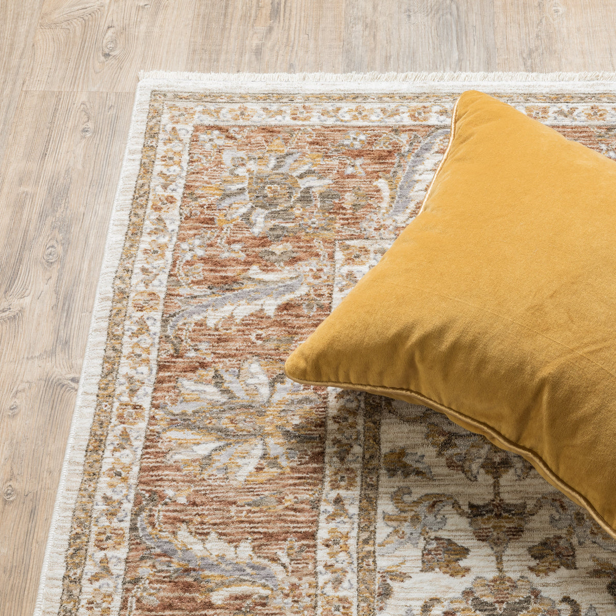 Classic floral pattern rug with cream center, terracotta border and ornate medallion design