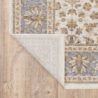 Cream and blue traditional floral area rug with ornate damask border design