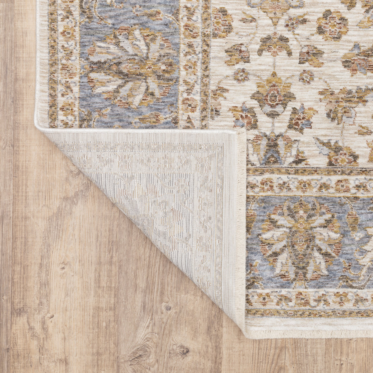 Cream and blue traditional floral area rug with ornate damask border design