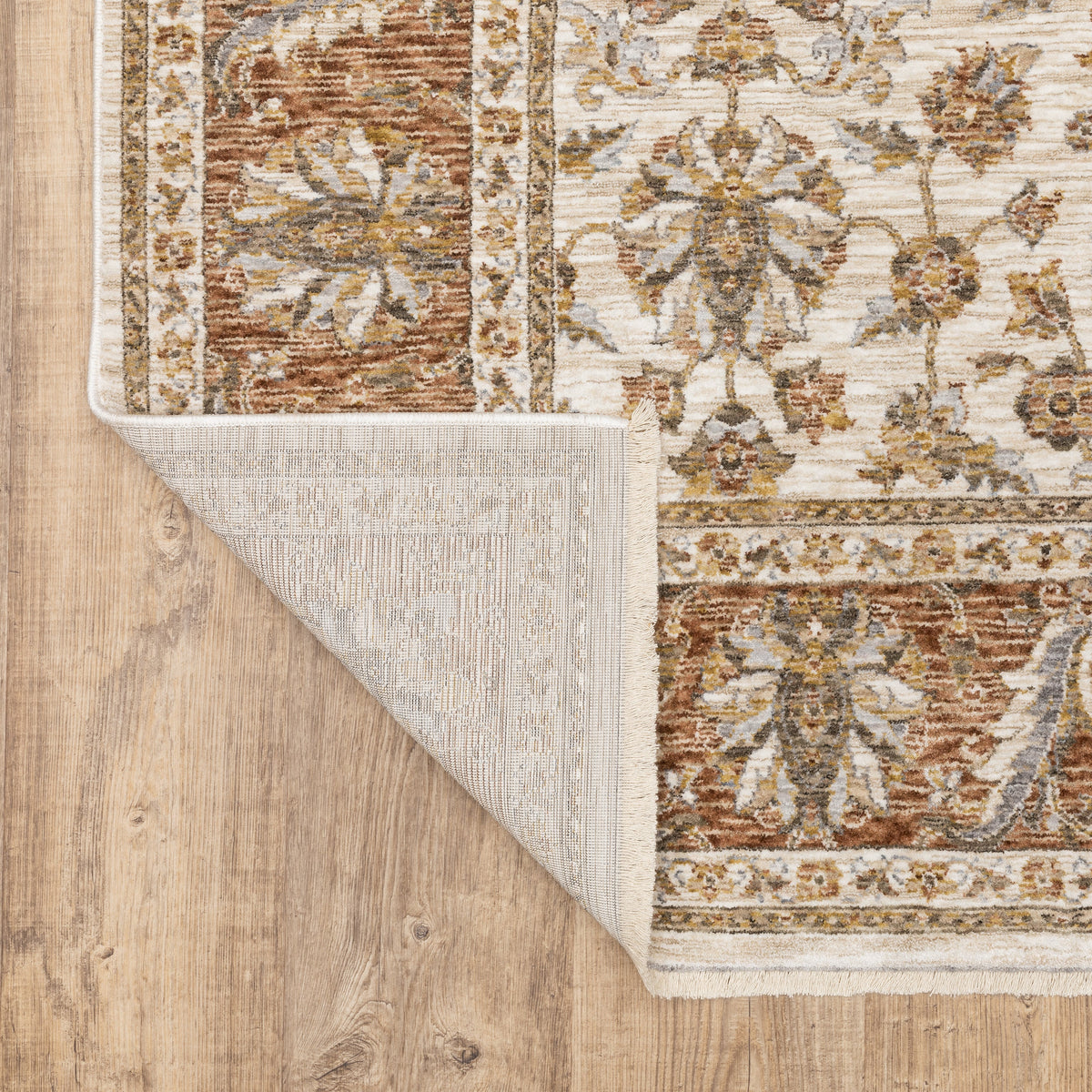 Classic floral pattern rug with cream center, terracotta border and ornate medallion design