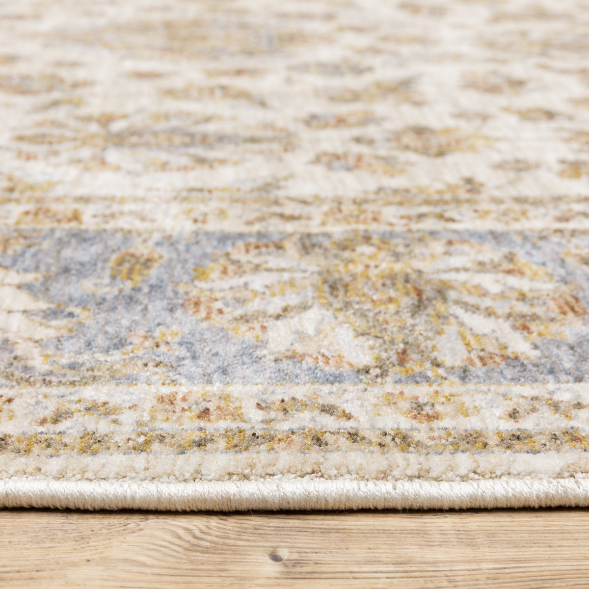 Cream and blue traditional floral area rug with ornate damask border design