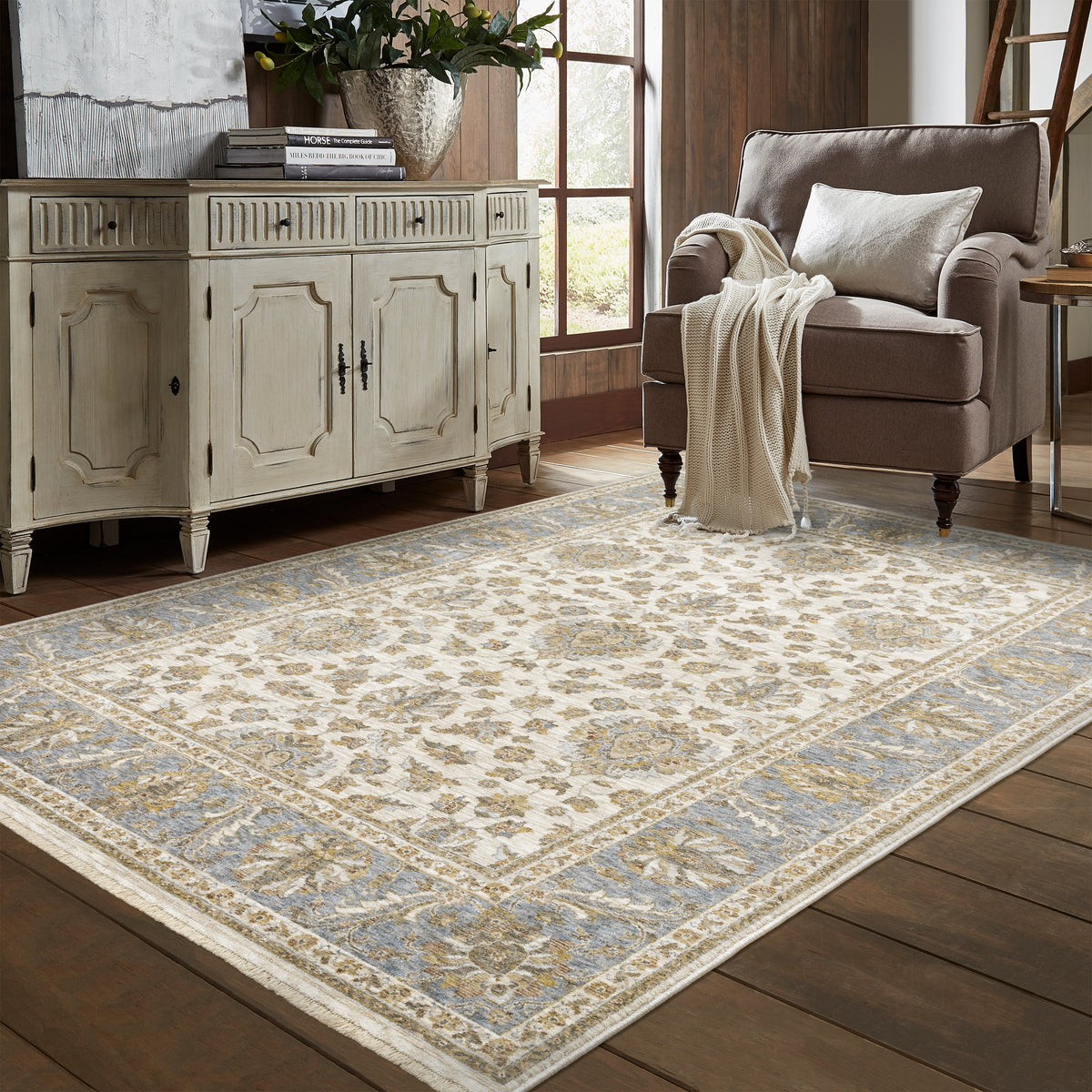 Cream and blue traditional floral area rug with ornate damask border design