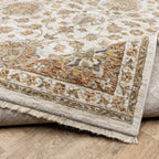 Classic floral pattern rug with cream center, terracotta border and ornate medallion design