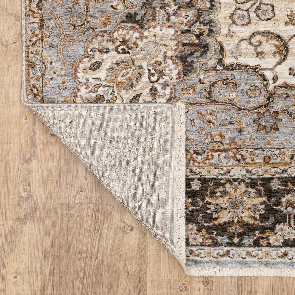 Beige traditional Persian style rug with ornate medallion and floral border patterns