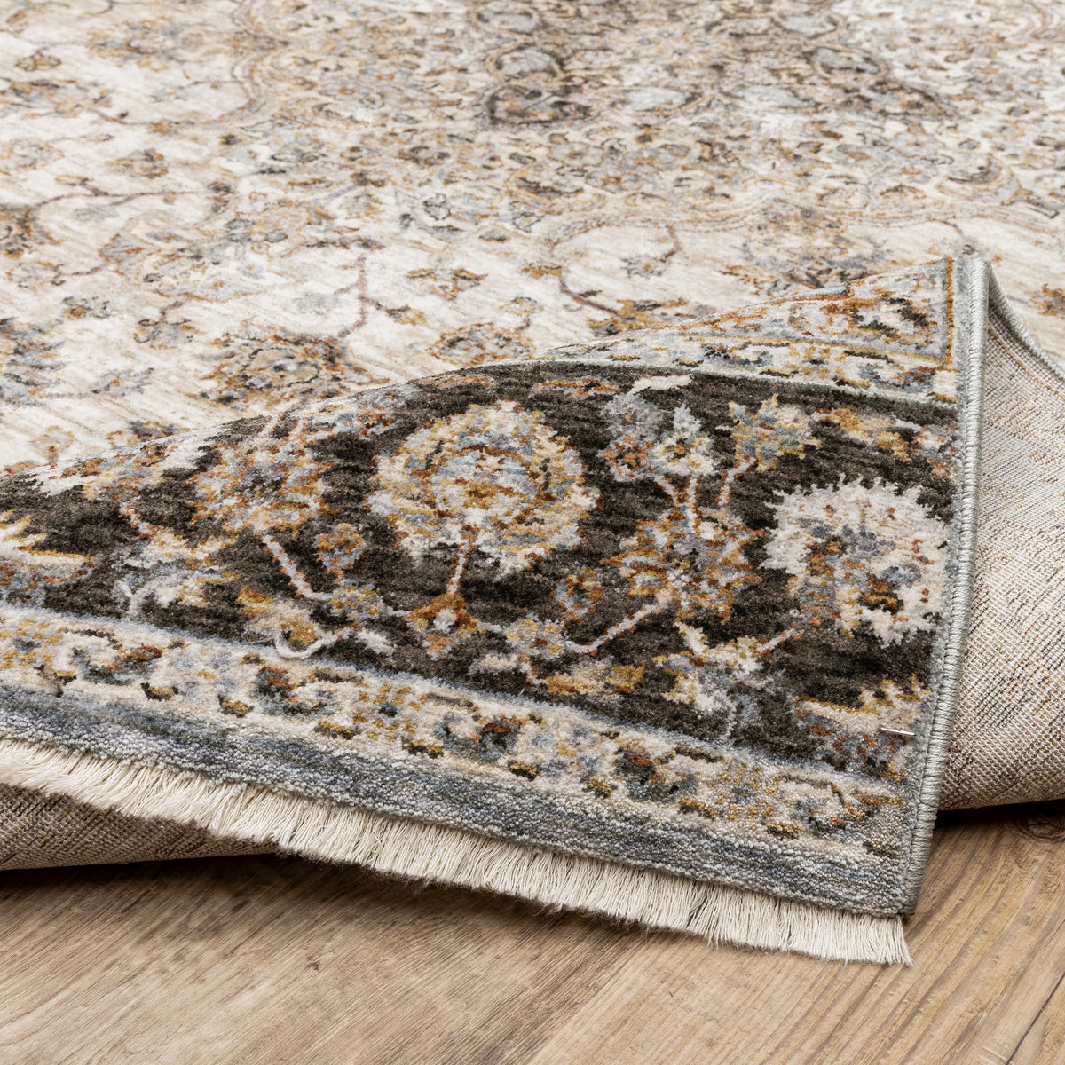 Beige traditional Persian style rug with ornate medallion and floral border patterns