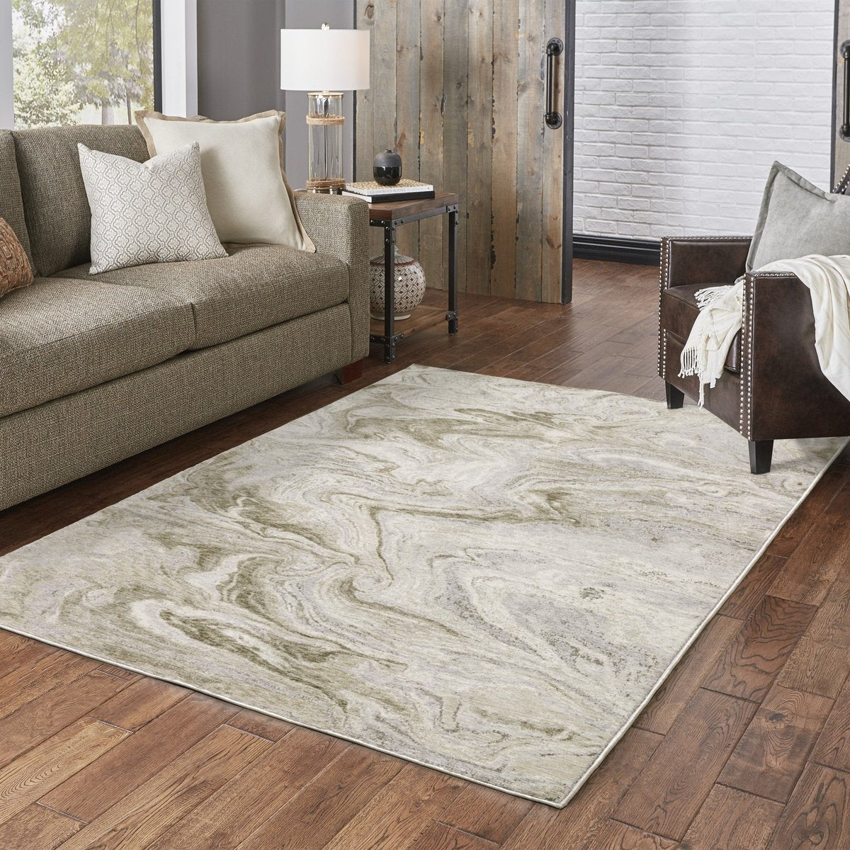Beige and taupe marbled swirl pattern area rug with textured finish