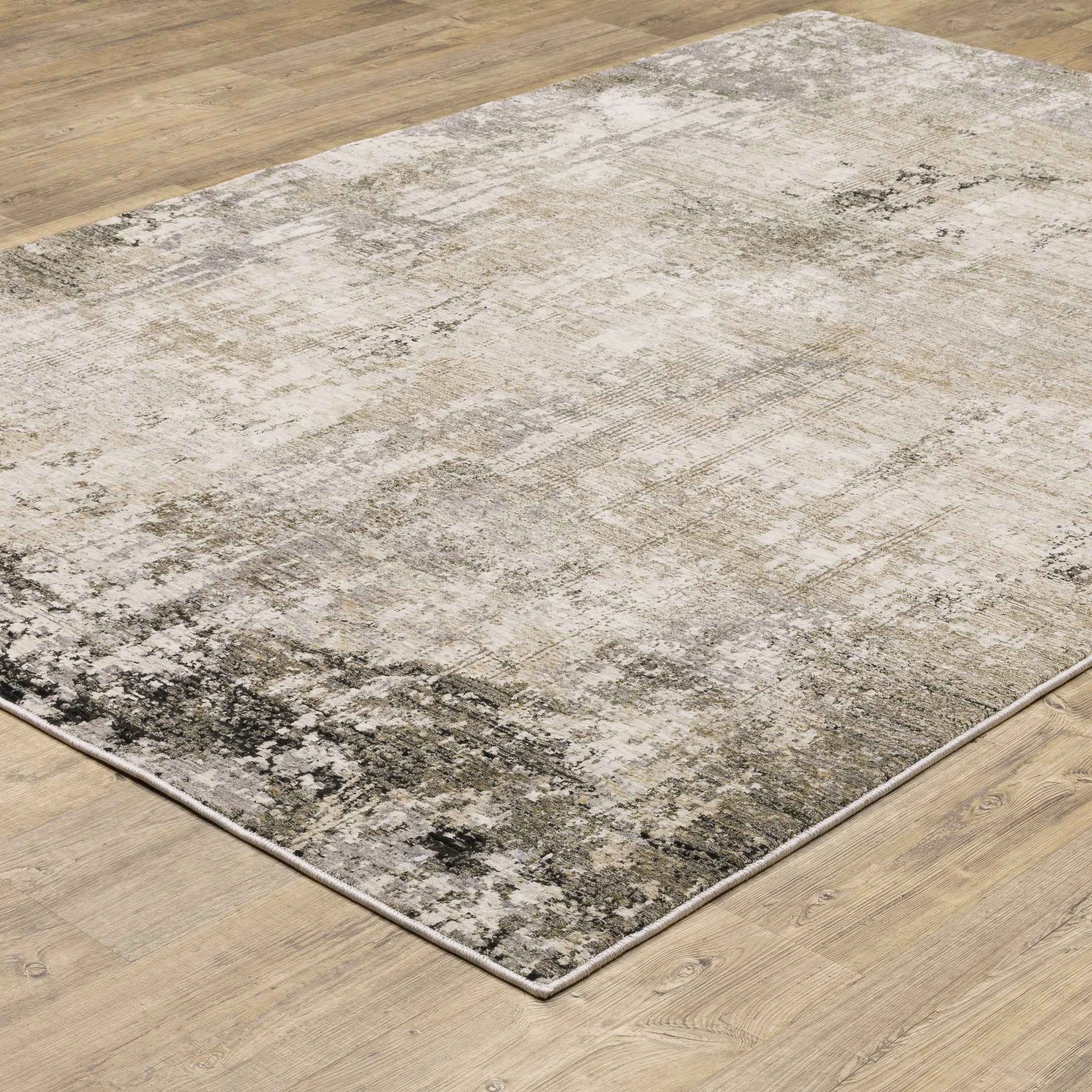 Modern living room with distressed gray and beige area rug under black coffee table