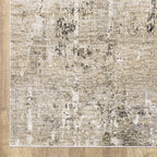 Modern living room with distressed gray and beige area rug under black coffee table