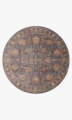 Vintage-style area rug with ornate floral medallions in blue, rust, and gold tones