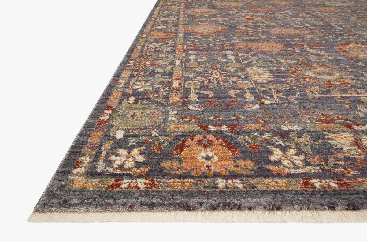 Vintage-style area rug with ornate floral medallions in blue, rust, and gold tones