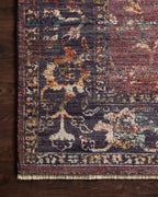 Burgundy distressed rug with ornate floral patterns in cream and rust tones