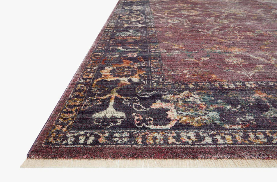 Burgundy distressed rug with ornate floral patterns in cream and rust tones