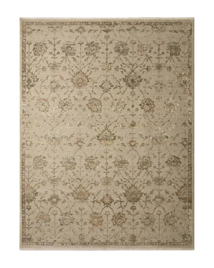 Beige and tan distressed floral pattern rug on dark wood flooring