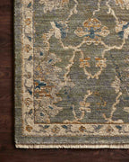 Gray traditional rug with floral botanical pattern and cream border