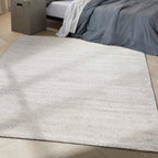 Neutral beige textured area rug with subtle linear pattern and natural fiber appearance