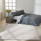 Neutral beige textured area rug with subtle linear pattern and natural fiber appearance