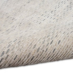 Neutral beige textured area rug with subtle linear pattern and natural fiber appearance