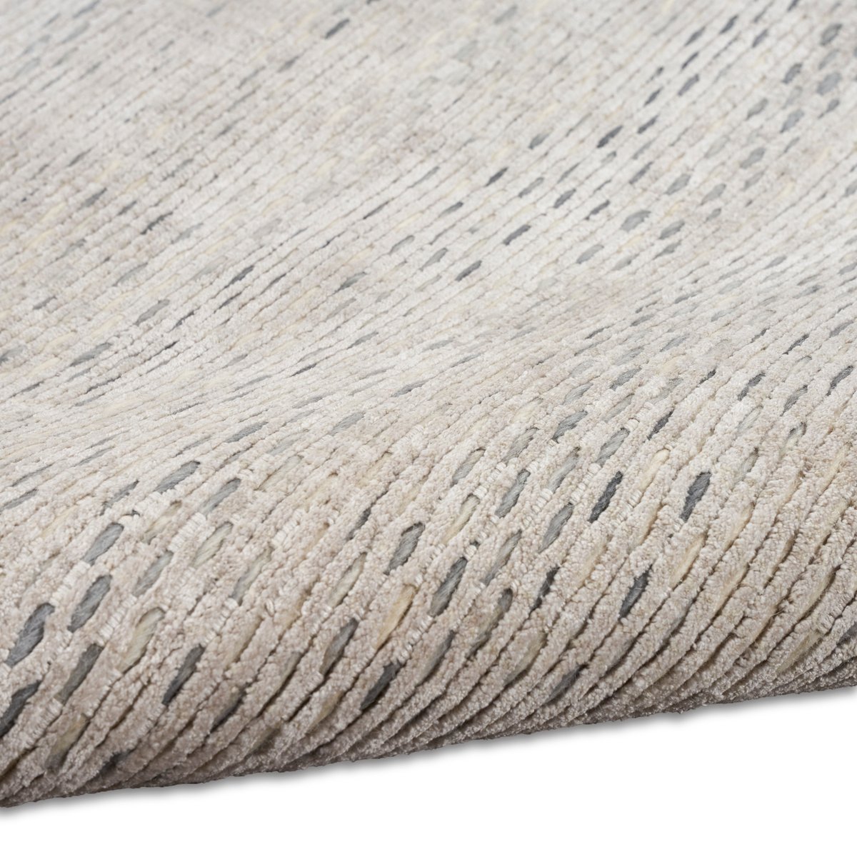 Neutral beige textured area rug with subtle linear pattern and natural fiber appearance