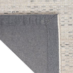 Neutral beige textured area rug with subtle linear pattern and natural fiber appearance
