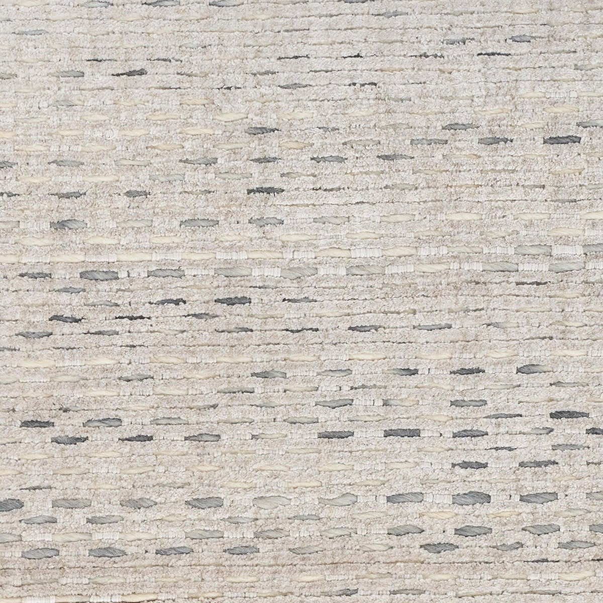Neutral beige textured area rug with subtle linear pattern and natural fiber appearance