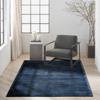 Dark blue textured area rug with subtle horizontal striations and woven pattern