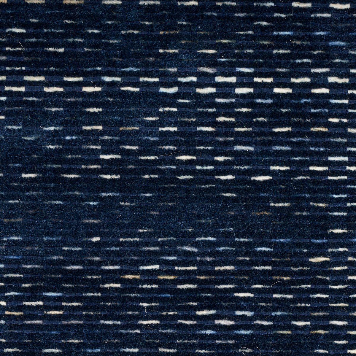 Dark blue textured area rug with subtle horizontal striations and woven pattern