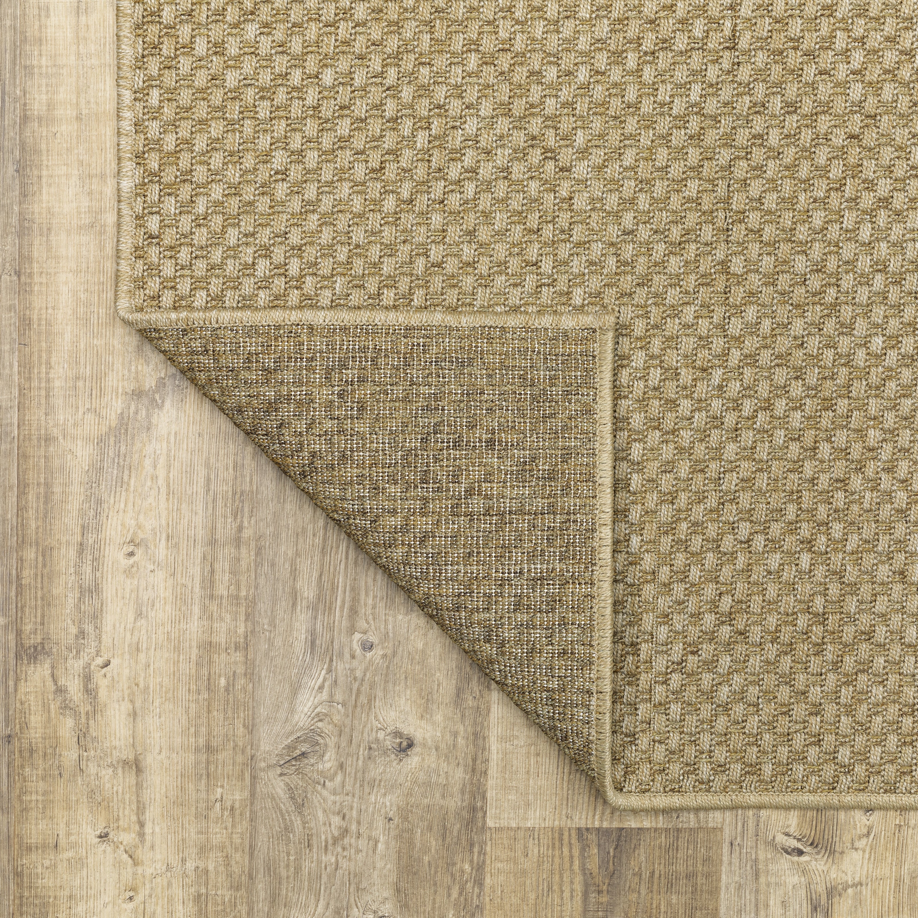 Natural beige textured woven rug with subtle crosshatch pattern