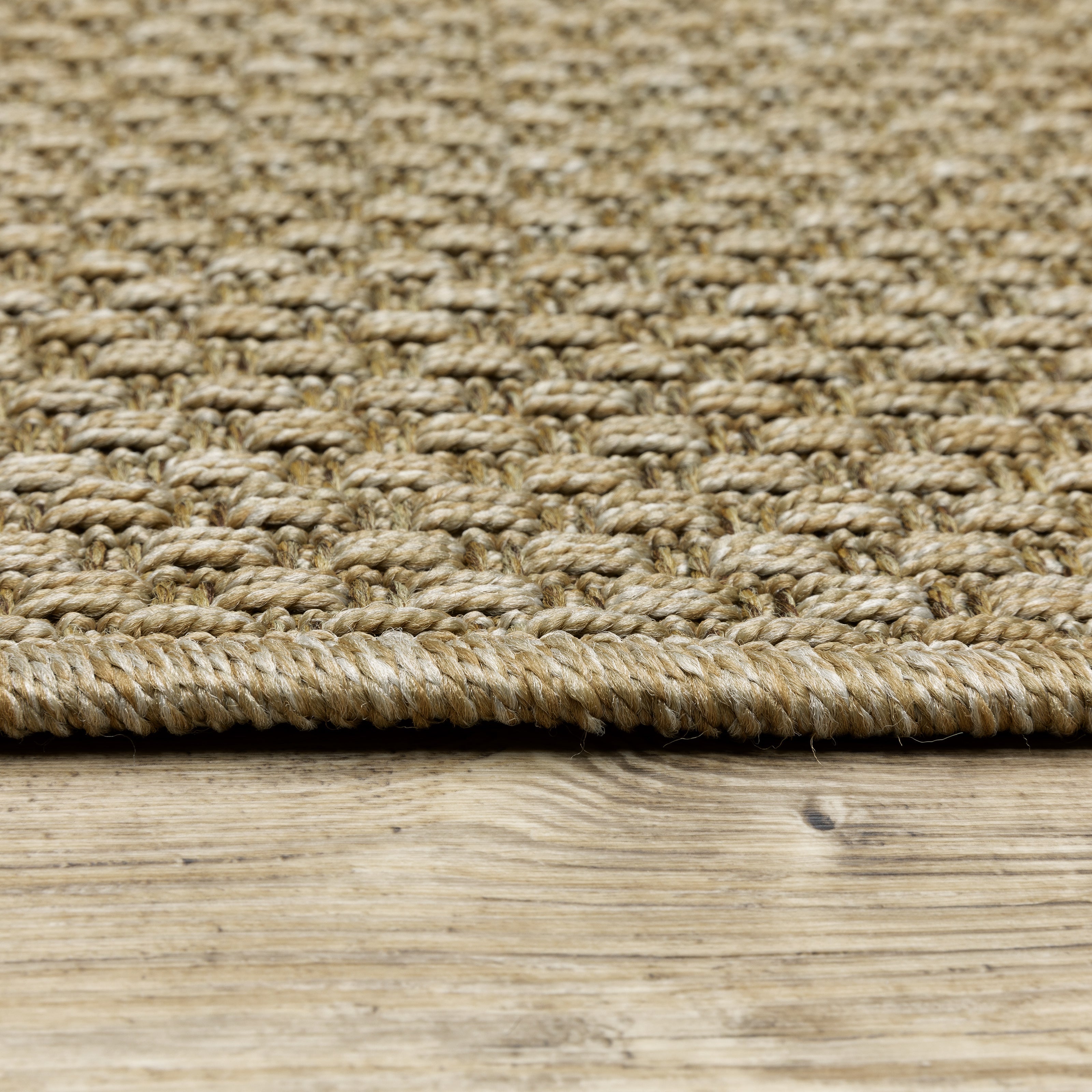 Natural beige textured woven rug with subtle crosshatch pattern