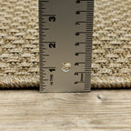 Natural beige textured woven rug with subtle crosshatch pattern