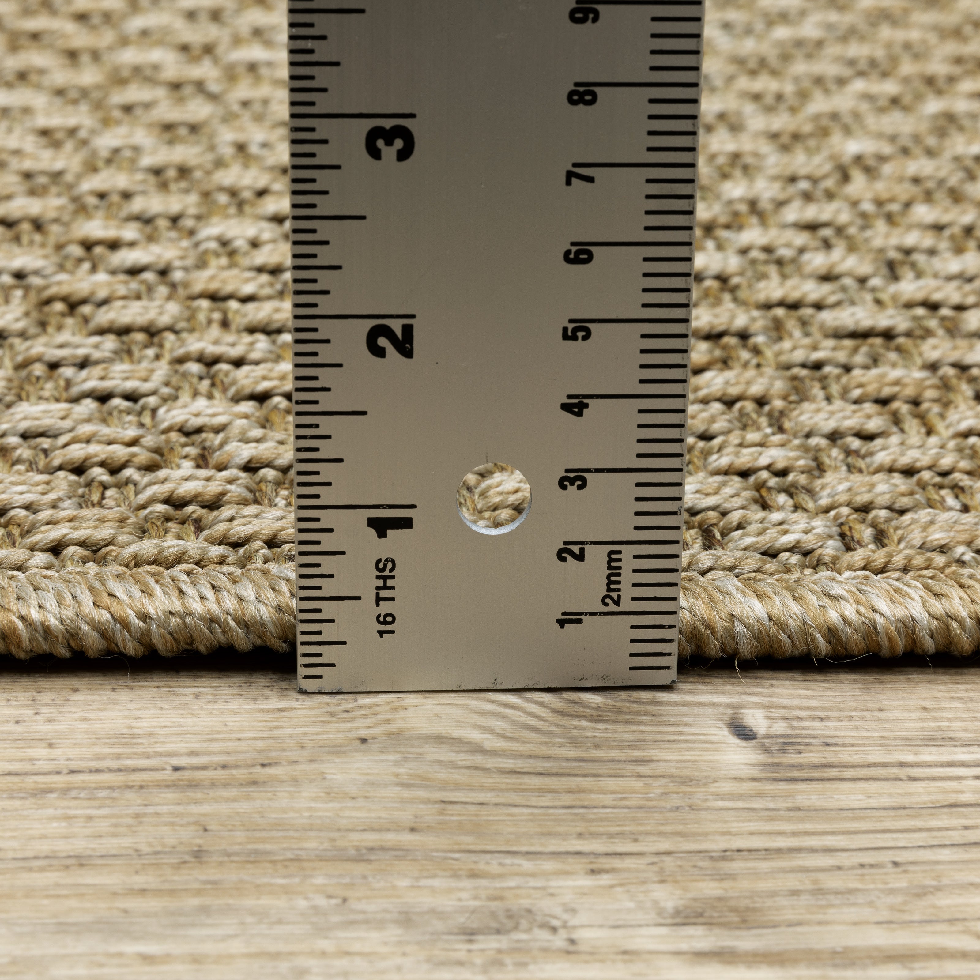 Natural beige textured woven rug with subtle crosshatch pattern