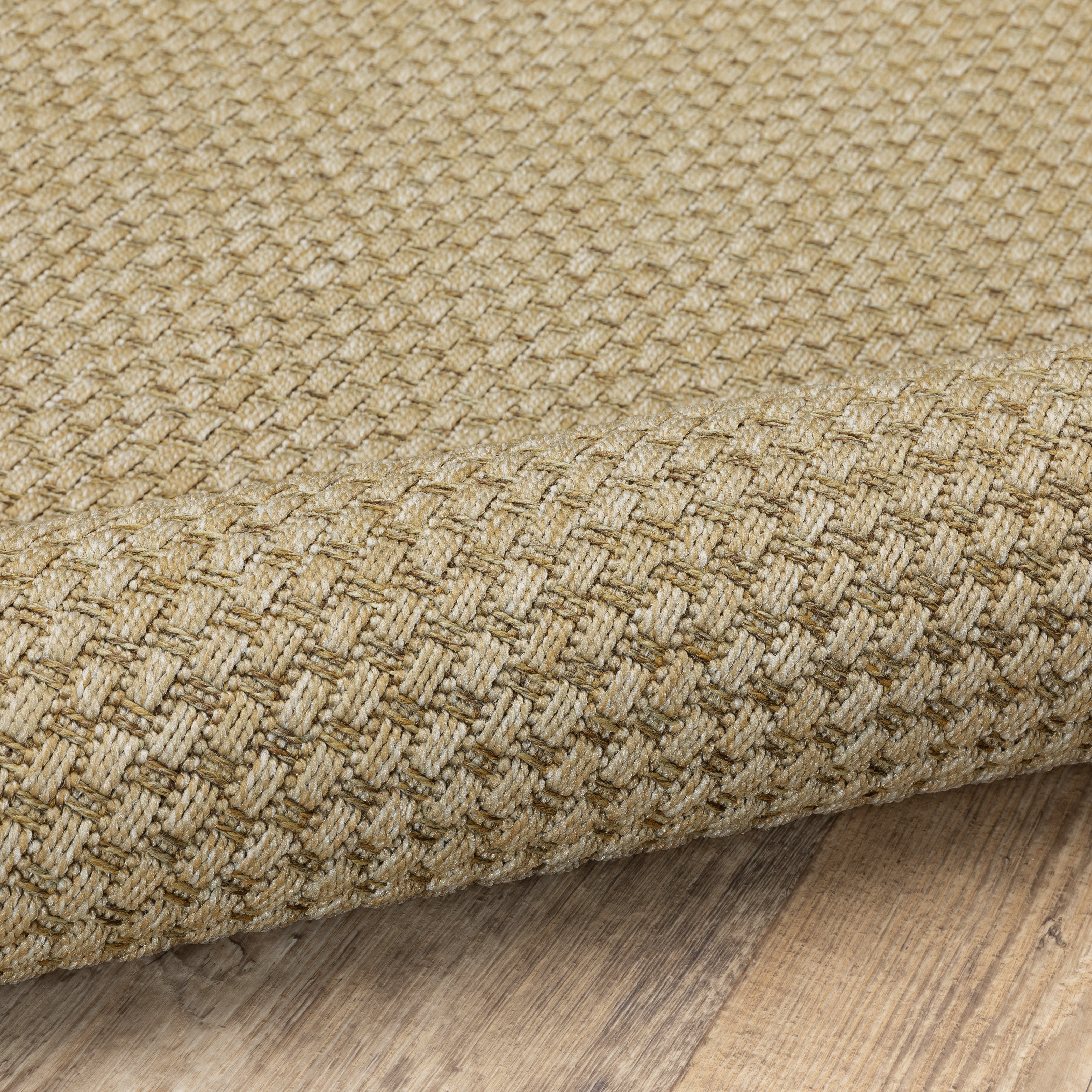 Natural beige textured woven rug with subtle crosshatch pattern